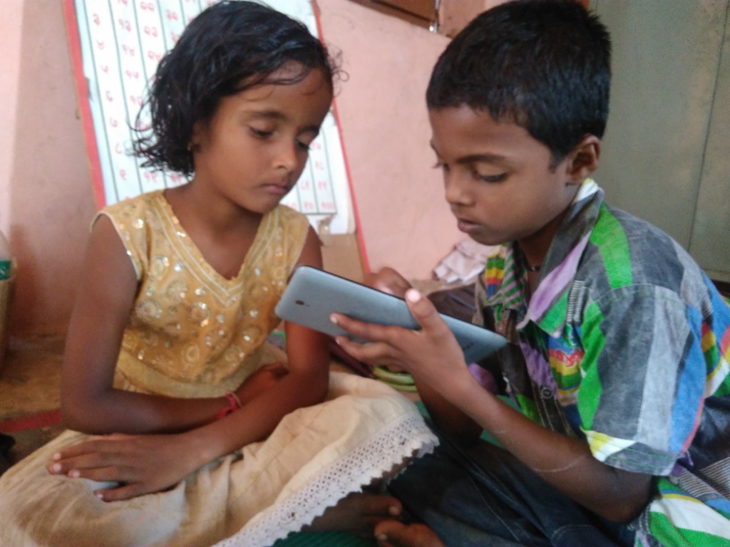 Children using a tablet for education